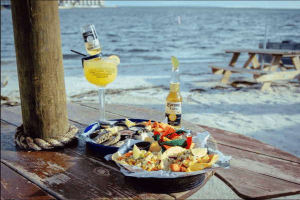 beer and meal with cocktail by the beach