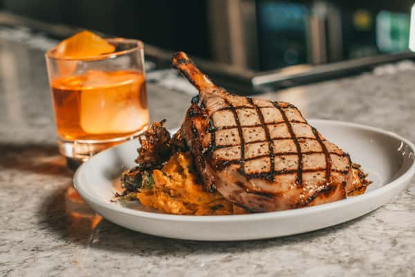 pork chop and a cocktail
