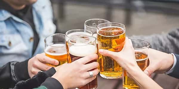 people toasting with drinks