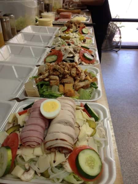 Assortment of cob salads in containers