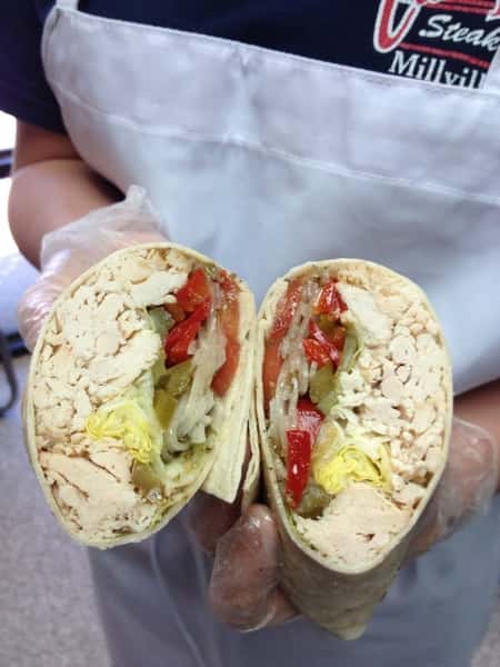 Open faced wrap with meats, lettuce, onions, and peppers
