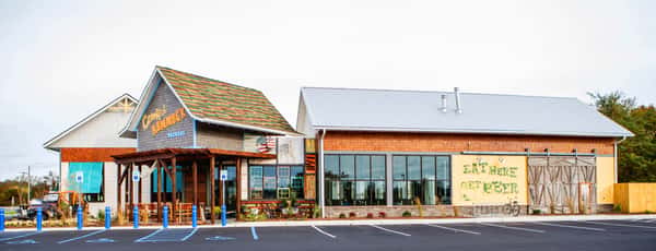 Vibrant exterior of Crooked Hammock Brewery with unique architecture and a colorful, welcoming entrance.