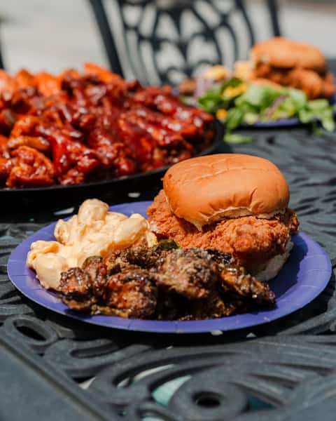 Plate with a chicken sandwich, and sides