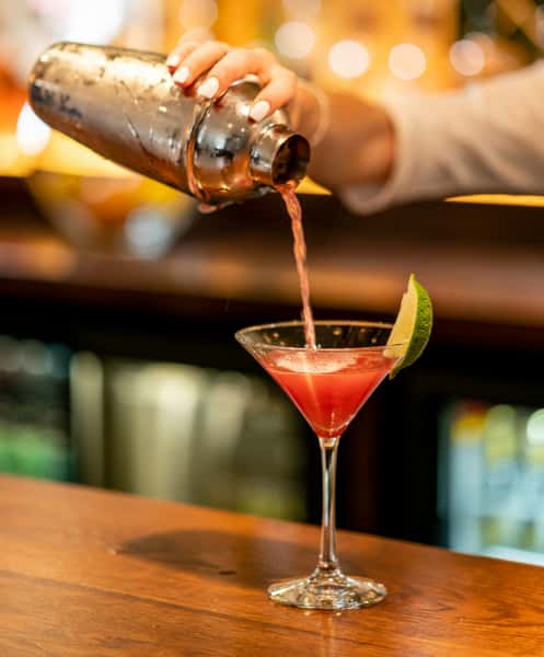 Bartender pouring a cocktail