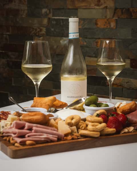 our Italian cold cuts board is crafted with the finest selection of meats, cheeses, and artisan accompaniments