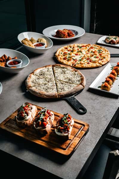 delicious variety of pizzas and bruschetta