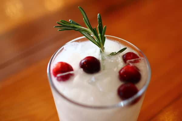 Cocktail with cherries and rosemary