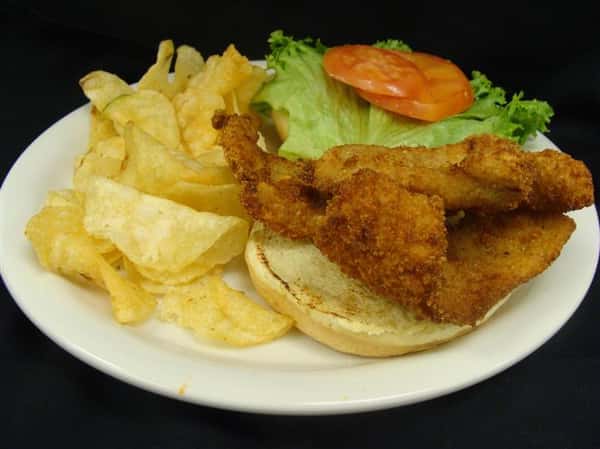 Fried sandwich with side of potato chips