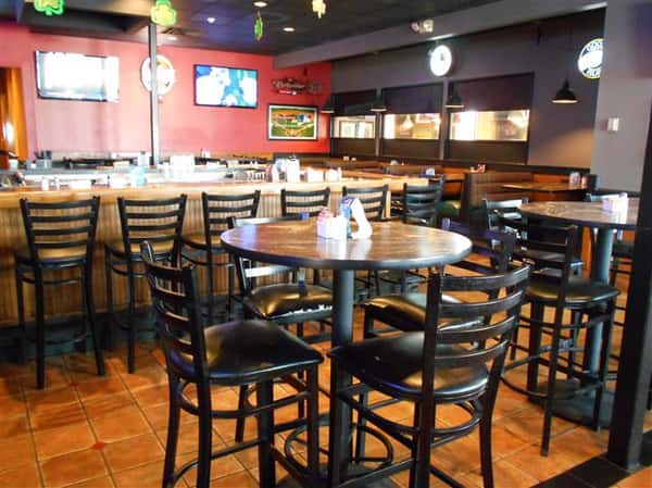 Bar area of restaurant with decorations and red walls