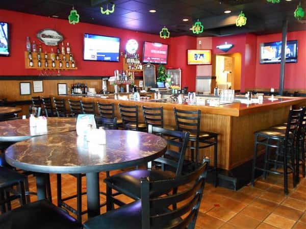 Bar area of restaurant with decorations and red walls