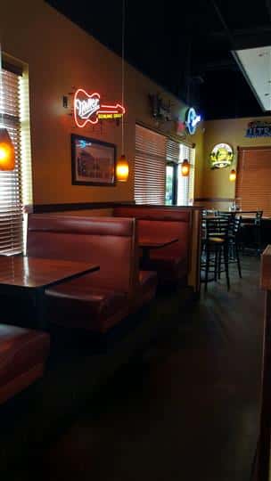 interior of restaurant with red booths