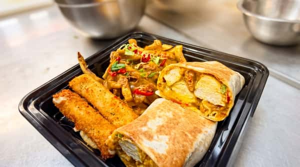 @Lunch chicken wrap meal with loaded fries, crispy chicken tenders, cheese, and sliced chillies