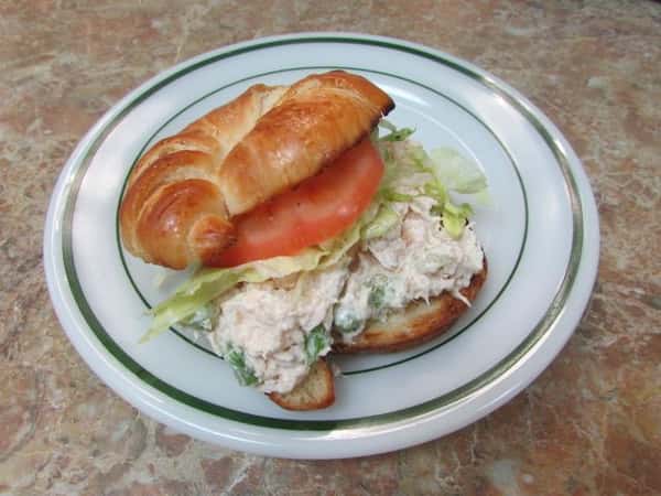 Chicken Salad, shredded lettuce an a tomato on a Croissant