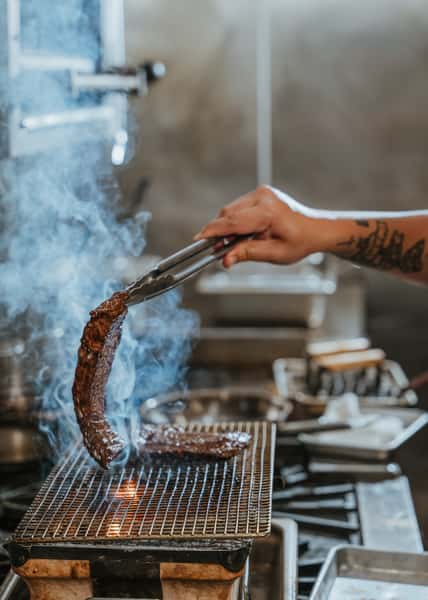 steak getting grilled