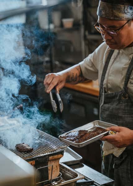 chef grilling steak