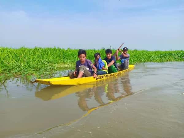 Children in a Yellow Boat