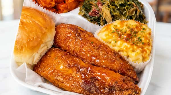 Glazed fish fillets with Southern comfort food sides at DSquared in St. Louis
