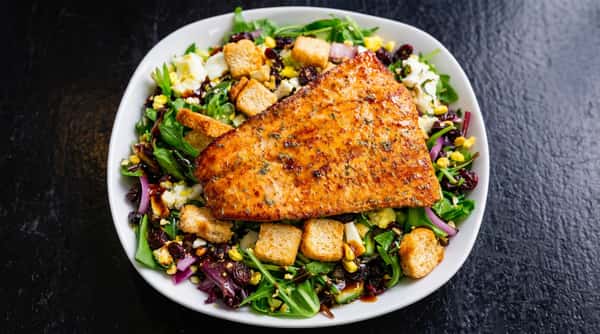 Seasoned grilled salmon salad with mixed greens and croutons at DSquared in St. Louis