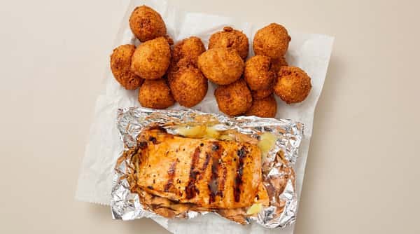 Grilled salmon fillet with golden hushpuppies at DSquared in St. Louis