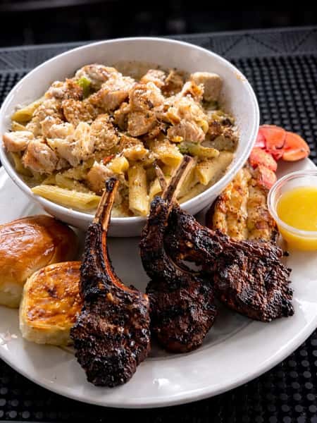 Glazed turkey ribs with seasoned pasta and sides at DSquared in St. Louis