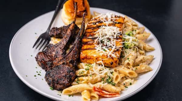 Grilled salmon and lamb chops with creamy pasta at DSquared in St. Louis