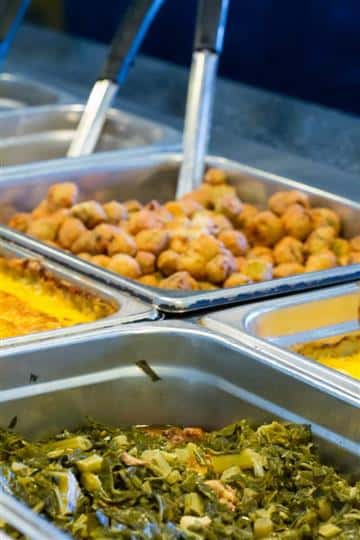 fried okra and collards in buffet trays