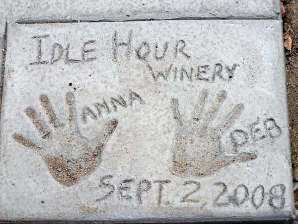 Owners hands paint in a rock