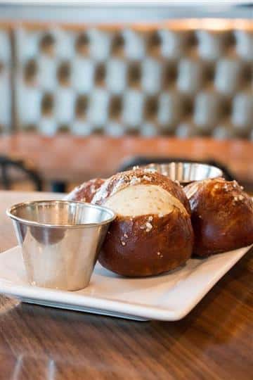 pretzel bites with 2 dipping sauces on the side