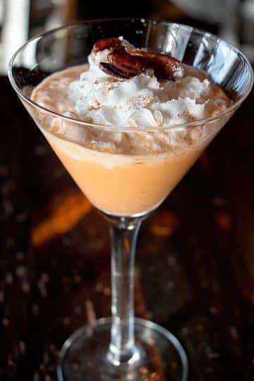 a martini sitting on the bar