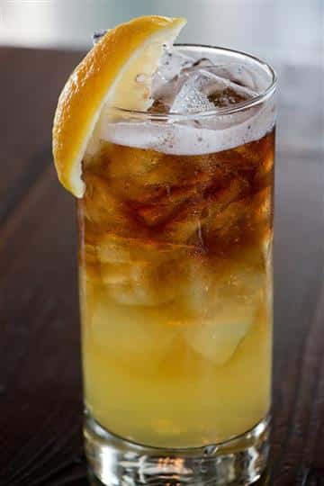 an alcoholic drink sitting on the bar