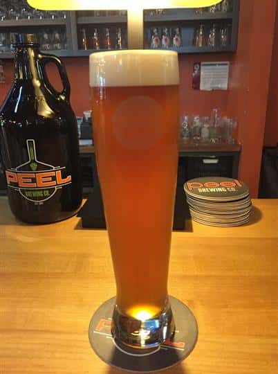 a glass of beer on the bar
