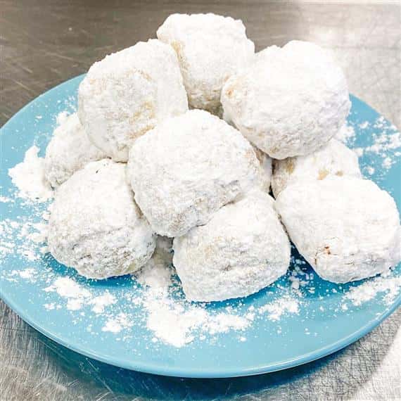 beignets on a plate on counter