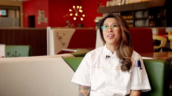 Snooze chef sitting down to talk to interviewer for episode 2