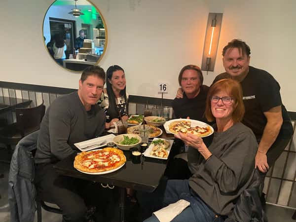 Family sharing meals inside restaurant