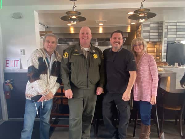 People smiling inside restaurant