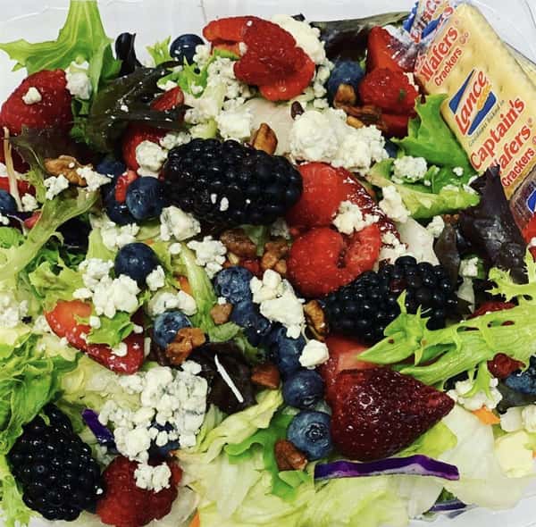 salad with berries and crumbled cheese