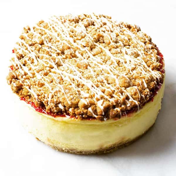 a cheescake with crumbs on it
