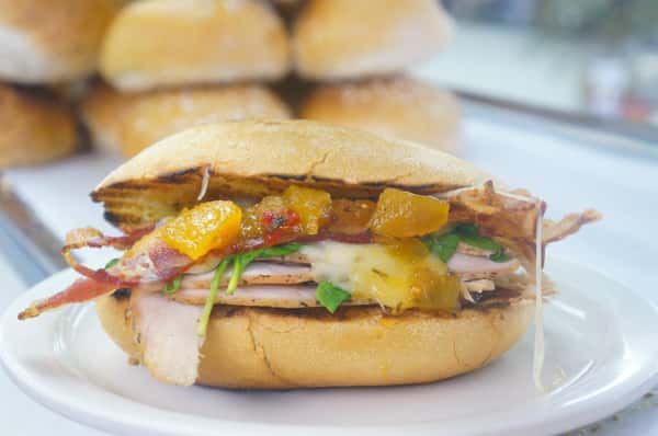 turkey, cheese, spinach, and mango salsa on a roll