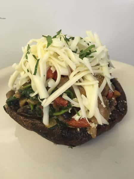 portabella mushroom stuffed with broccoli rabe, roasted red peppers and mushrooms then topped with mozzarella cheese