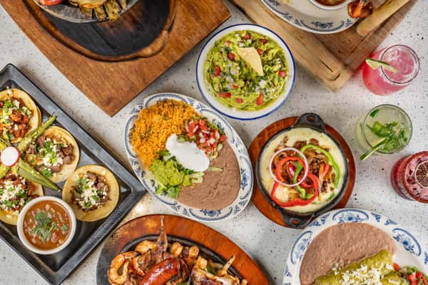 Plates of Mexican food on a table