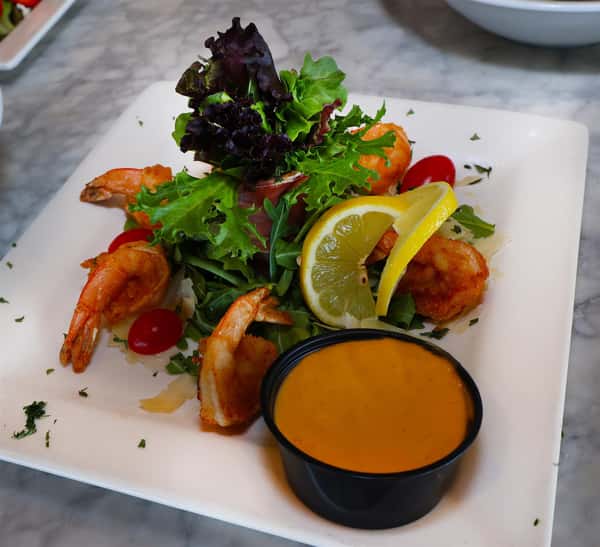 salad with shrimp, lemon, and a dipping sauce