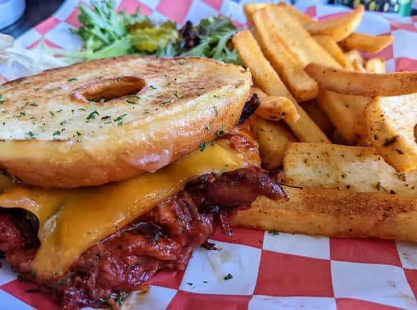 Bagel meat cheese sandwich with fries