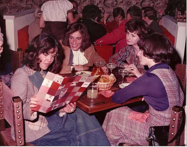 vintage image of a family eating at a table with drinks