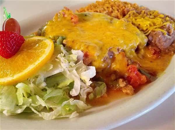 enchilada with salad and rice