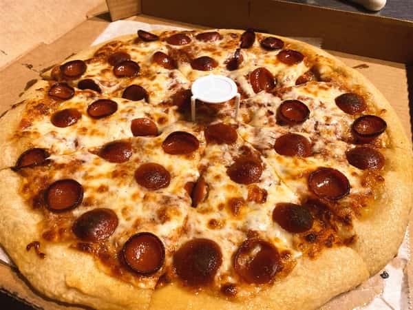 pepperoni pizza in a box