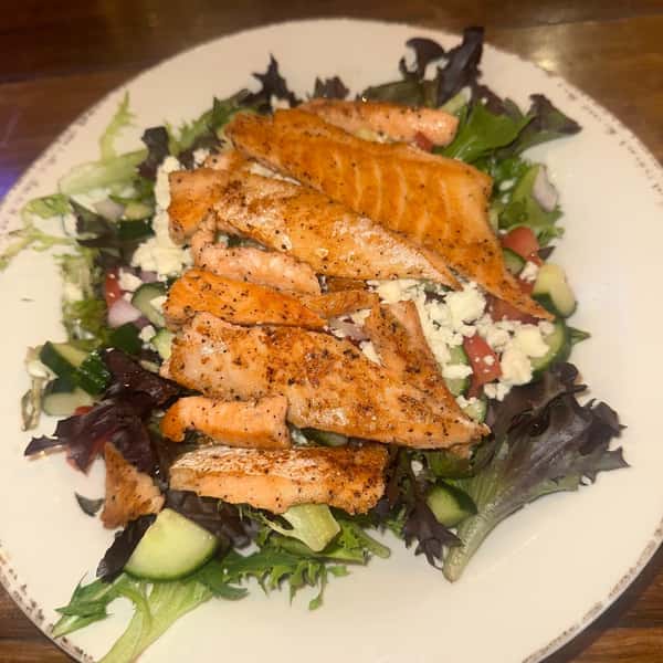 New menu item alert! Salmon salad! Freshly grilled salmon atop a bed of mixed greens, cucumbers, and feta. Your choice of house-made dressing. So so so good!
