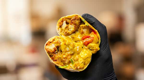 Chicken burrito with fries and dipping sauces