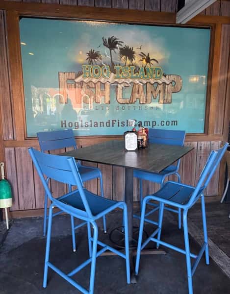 Simple seating near large restaurant logo