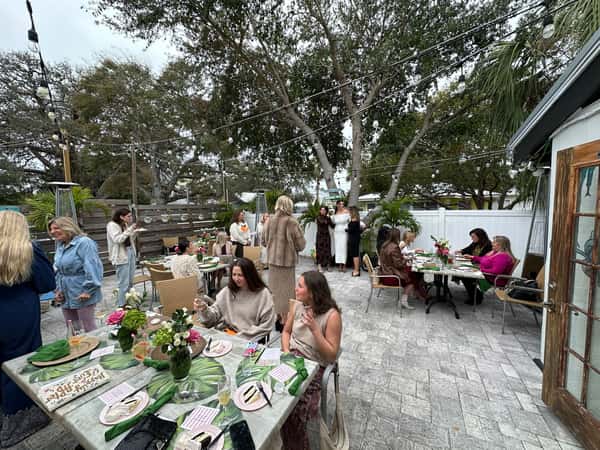 Customers enjoying their meals in the outdoor dining area