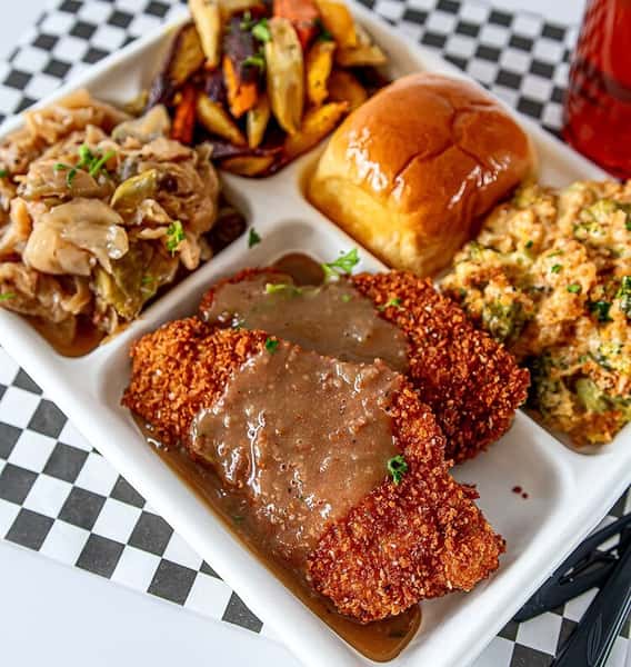 fried chicken dinner with sides and dinner roll